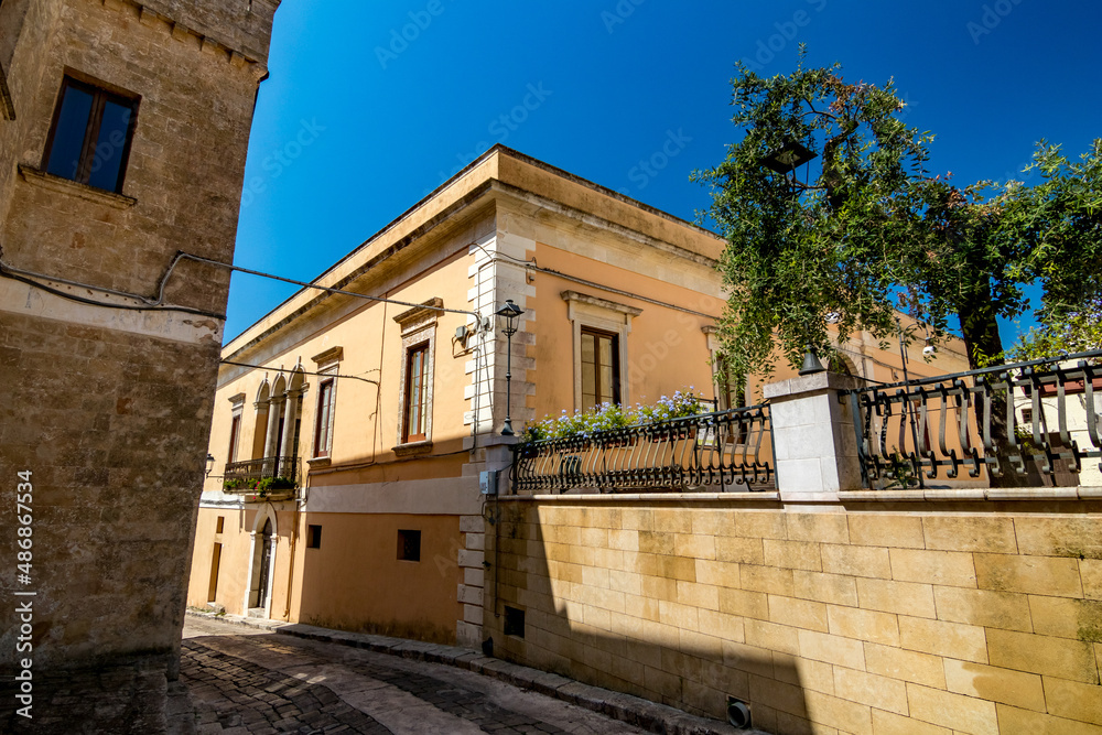 Limestone house. Travel street view. Monte Roberto, region of Ancona, Italy. Beautiful sunny cloudless sky spring day.