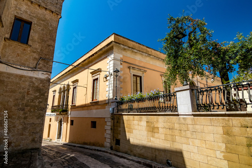 Limestone house. Travel street view. Monte Roberto, region of Ancona, Italy. Beautiful sunny cloudless sky spring day.