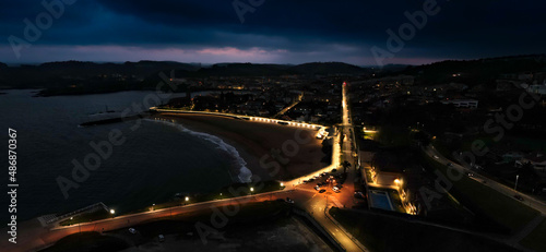 aerial view of Luanco, its beach and its port at dusk, asturias, spain