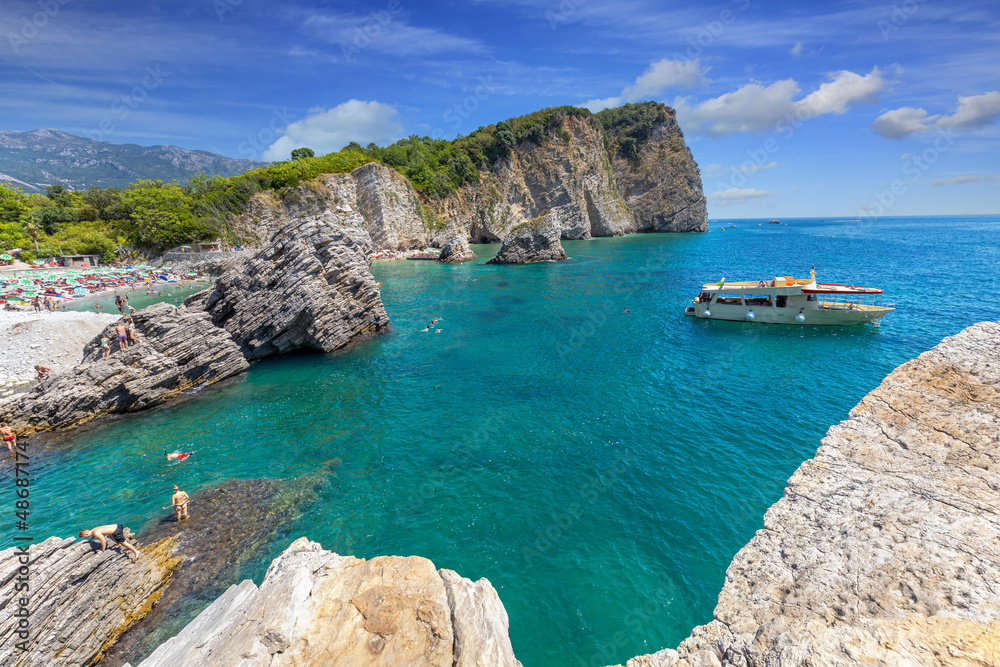 Fototapeta premium Montenegro. Budva. Hawaii island. Adriatic sea. Summer, sunny day. Deep blue sea. Colors of the sea. Rocks in the sea.
