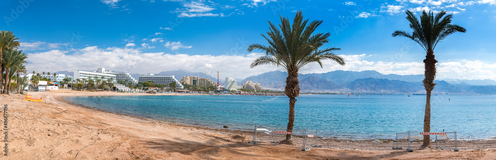 Panorama. Central beach in Eilat - famous tourist resort and recreational city located on the Red Sea, Israel