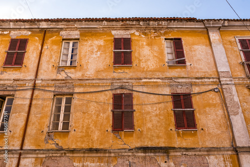 Facade of colorful block with shuttered windows in a typical Abruzzo town (Italy)