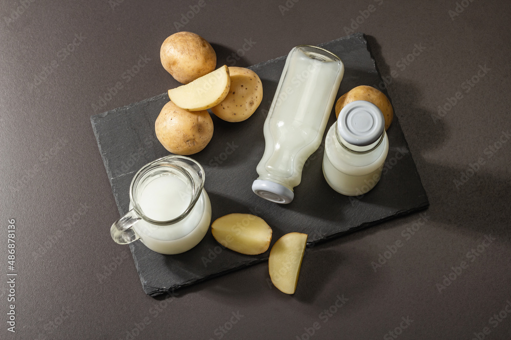 Fototapeta premium Alternative potato milk, trendy non-dairy drink. Lactose free vegan plant beverage
