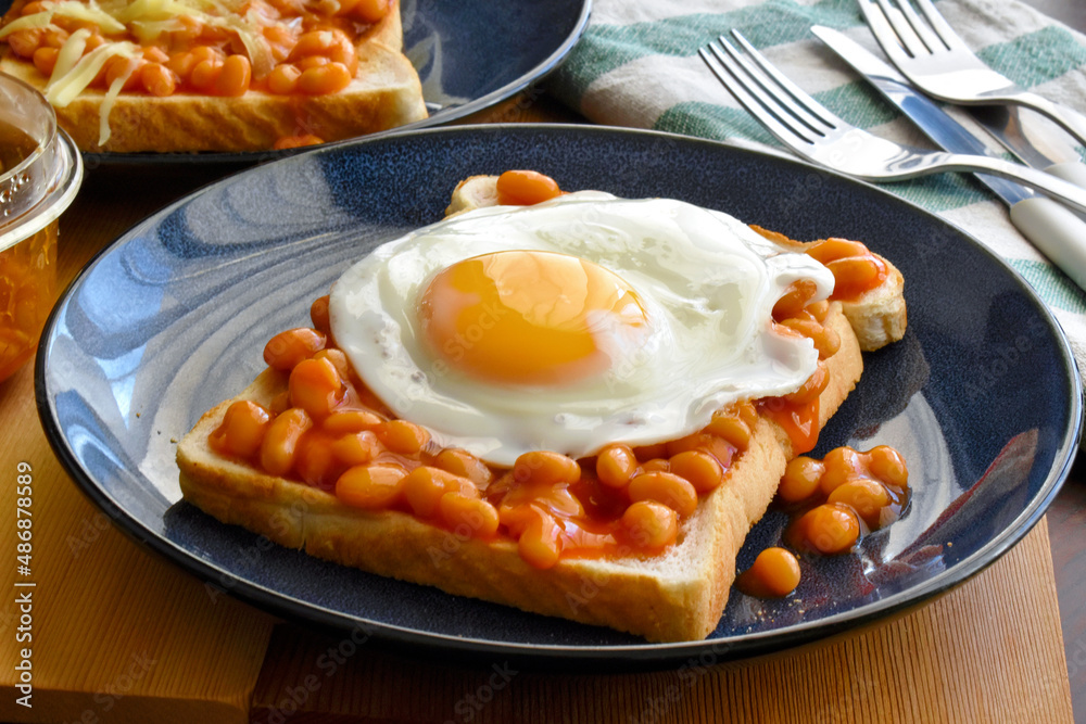 Egg and beans on toast. English breakfast style. Stock Photo Adobe Stock