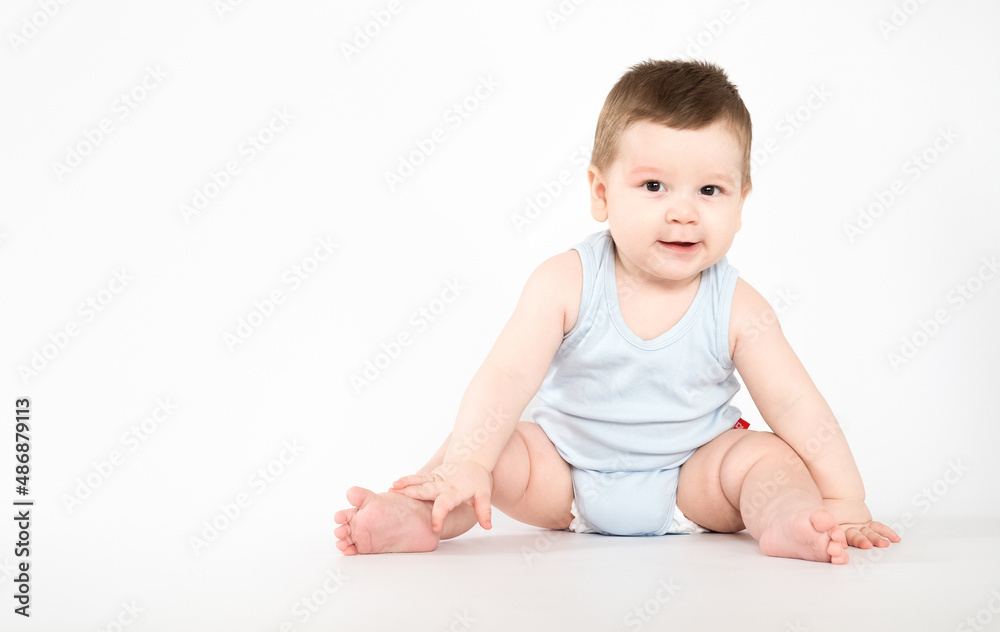 child baby boy sitting happy smiling boy on a white 7 month background child baby boy sitting happy smiling boy on a white 7 month background