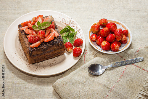 Homemade baking. Chocolate cake with strawberries and mint.