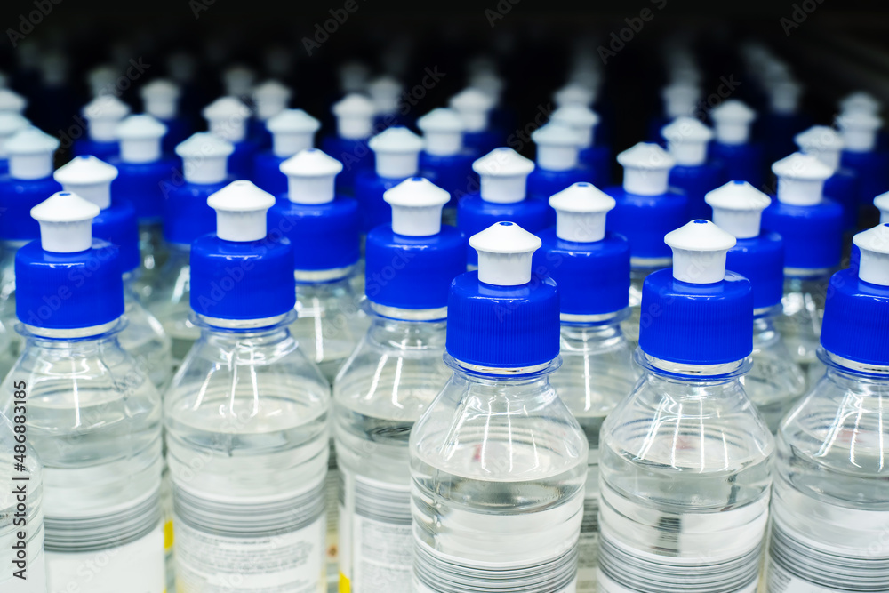 Plastic bottles with a small dispenser. Production of chemical products at an industrial enterprise. Close-up Plastic bottles with a small dispenser. Production of chemical products at an industrial enterprise. Close-up