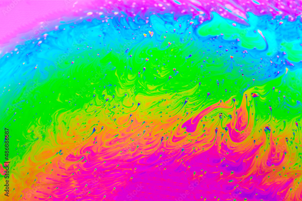 Abstract background with colorful rainbow gradient colors. Soap bubble close up psychedelic macro abstraction. Art design