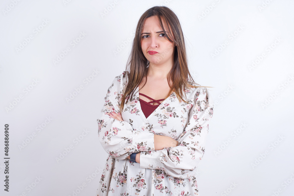 Picture of angry MODEL crossing arms. Looking at camera with disappointed expression. Picture of angry MODEL crossing arms. Looking at camera with disappointed expression.