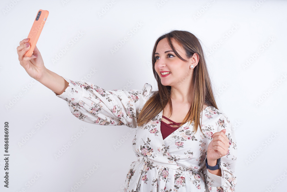 Portrait of a MODEL taking a selfie to send it to friends and followers or post it on his social media. Portrait of a MODEL taking a selfie to send it to friends and followers or post it on his social media.