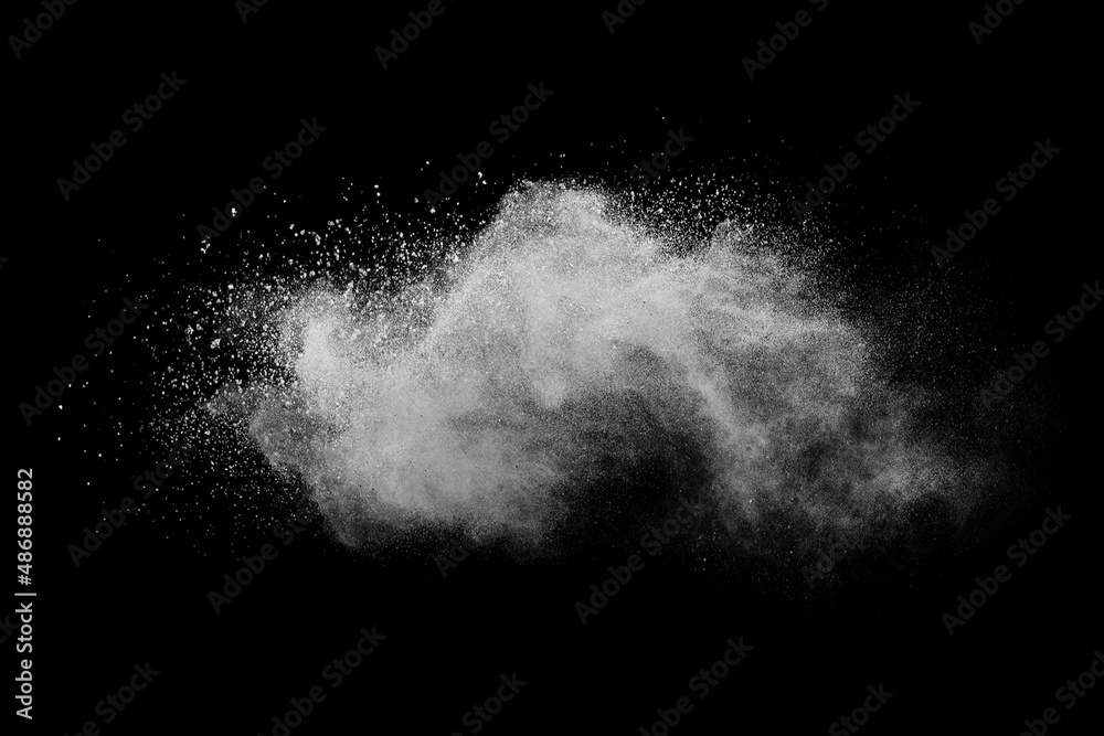 Fototapeta premium Explosion of white powder isolated on black background. Abstract colored background. holi festival.