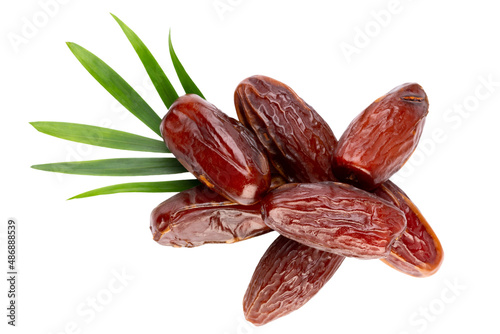 Dry dates isolated on white background. Top view. Flat lay pattern.