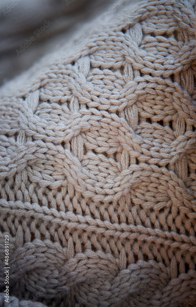 The texture of the knitted fabric of white threads The texture of the knitted fabric of white threads