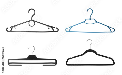 Set with different empty hangers on white background
