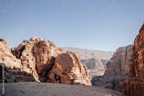 The ancient city of Petra in Jordan. Red sandstone mountains on a clear day. Caves in the rock. Landscape. Colorful photos.