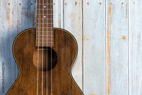 tenor ukulele on wooden background