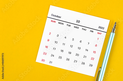 October 2022 calendar on yellow background.