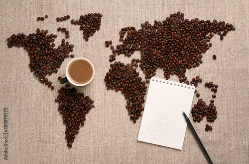 world map made of coffee beans and notebook for writing