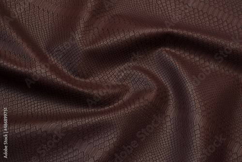 brown crocodile artificial leather with waves and folds on PVC base