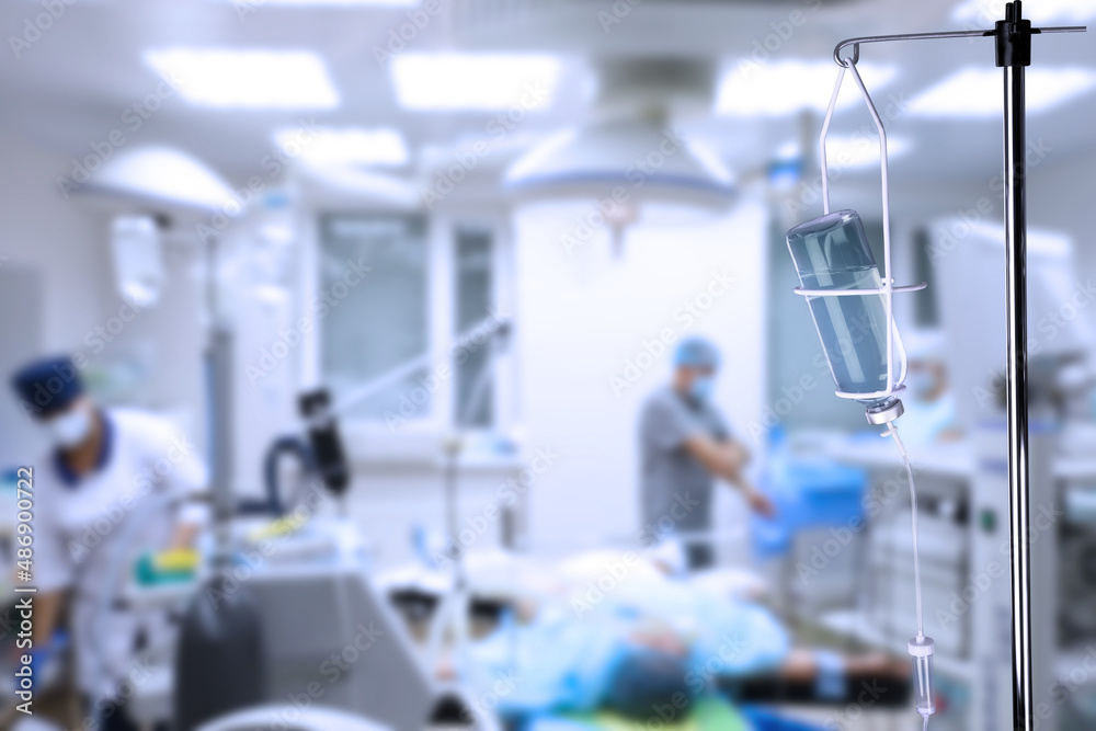 Drop counter with bottle of medicine in operating room. Space for text Drop counter with bottle of medicine in operating room. Space for text