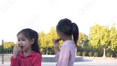 Slow motion scene ofAsian girls eating seaweed snacks