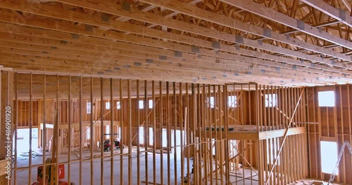 New building under construction frame stick built post wooden beam with insaide building view photo