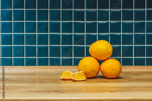 three yellow lemons in the kitchen