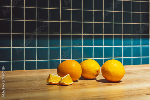 three yellow lemons in the kitchen