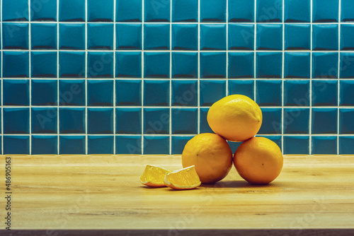 three yellow lemons in the kitchen