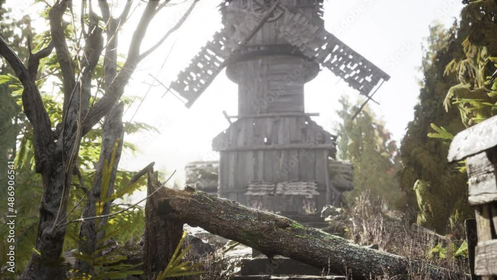 old traditional wooden windmill in the forest old traditional wooden windmill in the forest