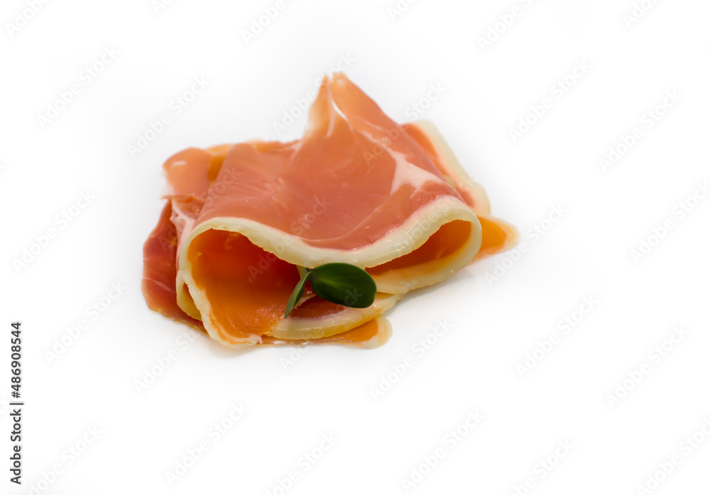 Jamon slice isolated on white raw detail Jamon slice isolated on white raw detail