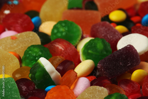 Bright candy lollies on white background