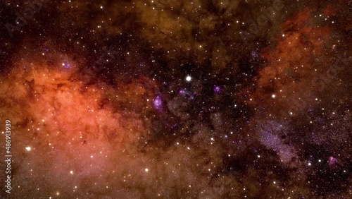Loopable, smooth, slow flight through the vast expanses of deep space, through galaxies and constellations. Looped seamlessly repeating animation. Orange abstract background. High quality 4k footage