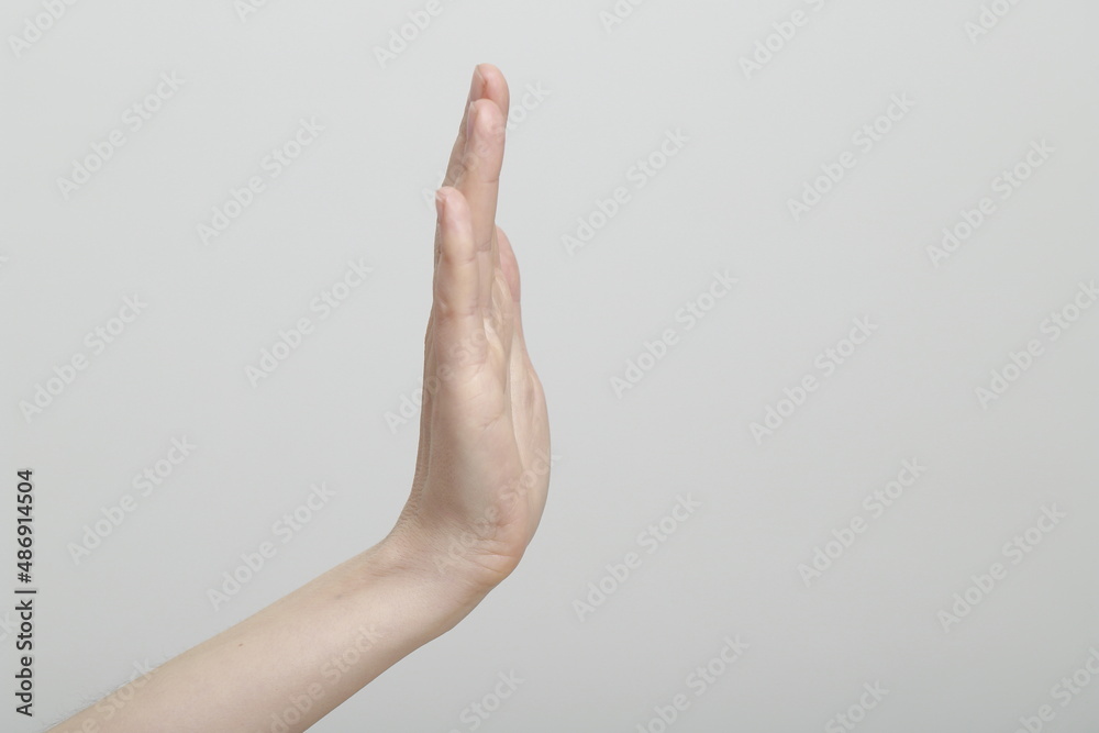Fototapeta premium Close up of woman hand showing stop sign