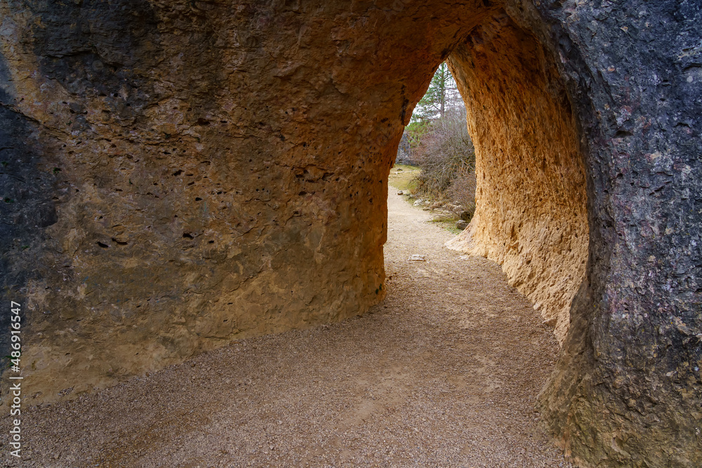 Tunnel formed in the stone rock eroded by time in the Enchanted City of Cuenca.