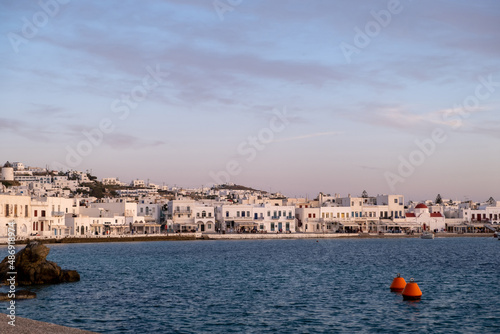 Greece, Mikonos island, Cyclades. Waterfront building, shop, sea, blue sky background.