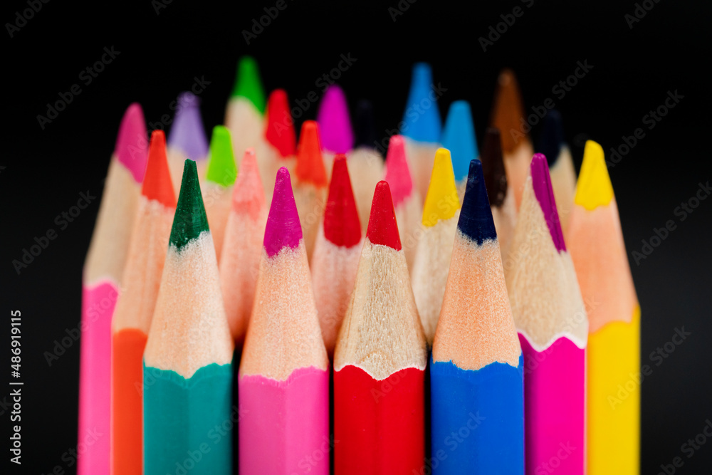 Wooden colored pencils isolated on a black background. Wooden colored pencils isolated on a black background.