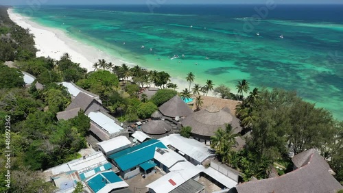 Diani beach Kenyan coast African Sea drone aerial 4k waves blue indan ocean tropical mombasa turquoise white sand East Africa palms paradise view photo