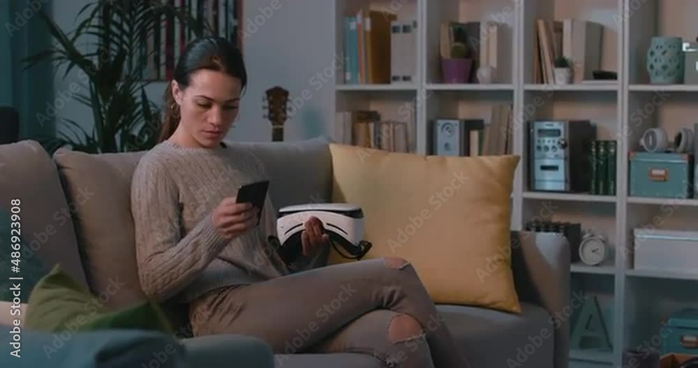 Woman interacting with virtual reality at home Woman interacting with virtual reality at home