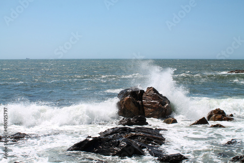 wave crashes against rock in the sea © raffaellagalvani