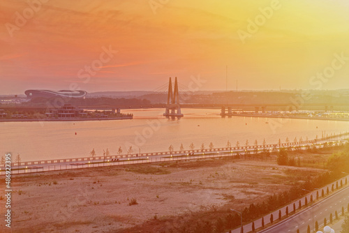 Millennium Bridge in Kazan  Russia. Cable-stayed bridge across the river. View from the Kremlin embankment. Beautiful city view at dawn. Panoramic view 