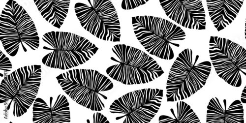 Silhouette tropical palm leaves seamless pattern. Black and white exotic botanical texture.