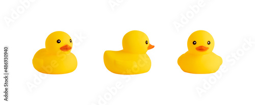 Foto Three yellow rubber duck toys isolated on white background.