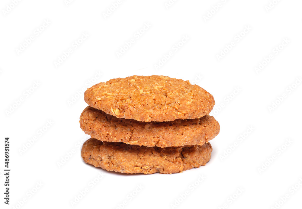 Oat vanilla sugar cookies isolated on white background. Close-up view of brown yellow snacks. Macro shot of beige biscuit cakes for your design Oat vanilla sugar cookies isolated on white background. Close-up view of brown yellow snacks. Macro shot of beige biscuit cakes for your design