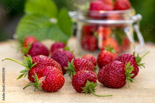 Ripe juicy strawberries on a wooden table. Healthy food rich in fiber  vitamins  antioxidants. Vegetarian food.