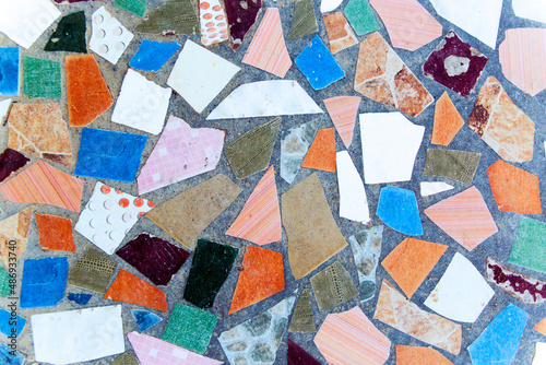 Colorful mosaic of broken tiles and stone decor © ivanchik29