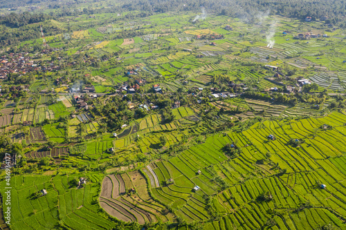 Aerial drone view of terraced rice paddies in the countryside near Amalapura in the Karangasem regency in northeast Bali in Indonesia photo