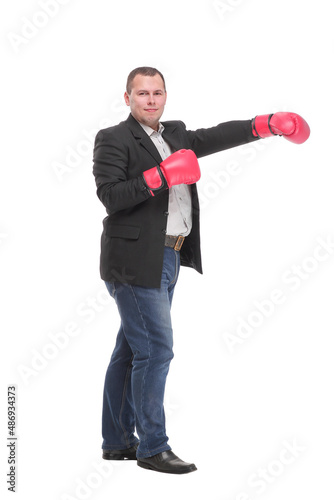 Profile of successful businessman punching and hitting with boxing gloves in full length isolated on white background,