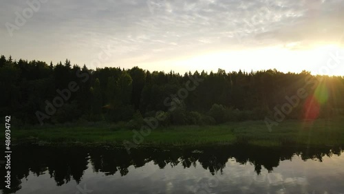 Summer aerial video of landscape with Volga-river. A major river of Russia. Flying over the water in the rays of the sun.