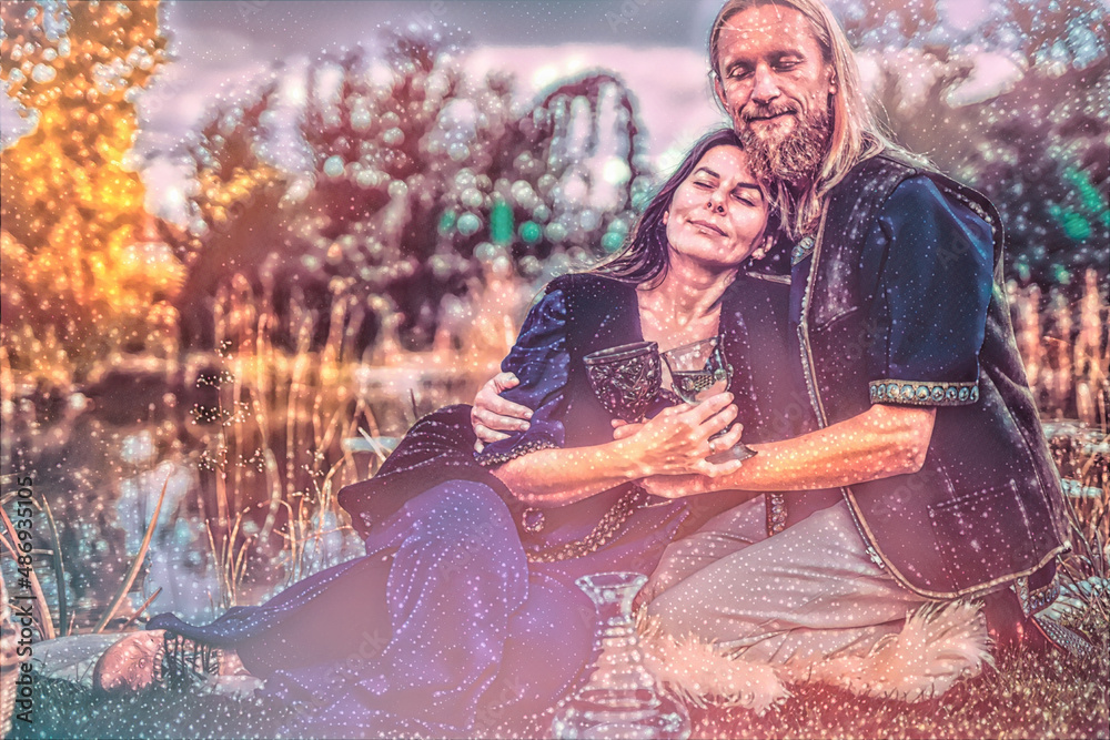 Fototapeta premium medieval man with beautiful medieval woman on a picnic. Painting effect.